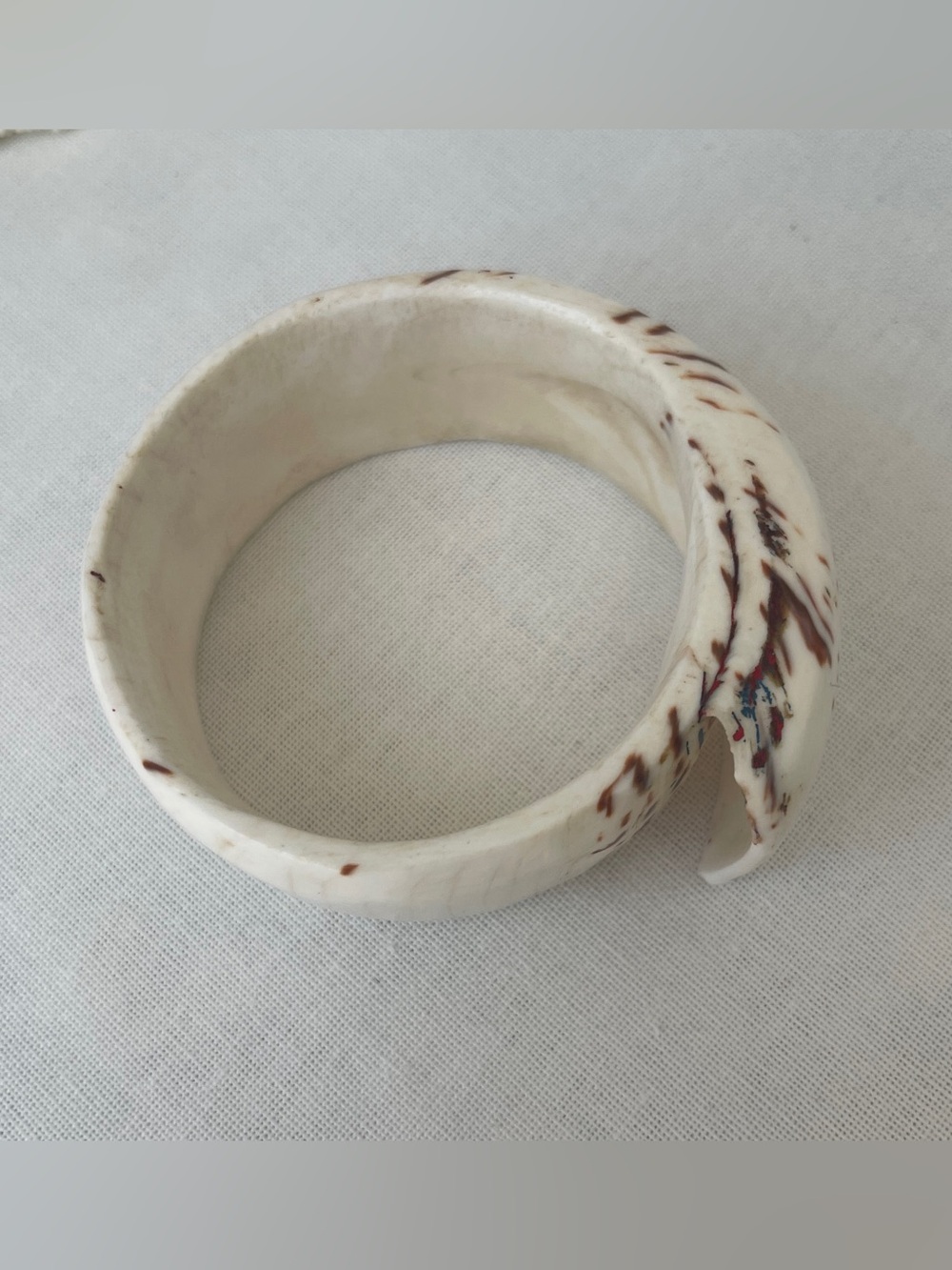 White Bangle with Burgundy Speckle Accent. Made of real material.